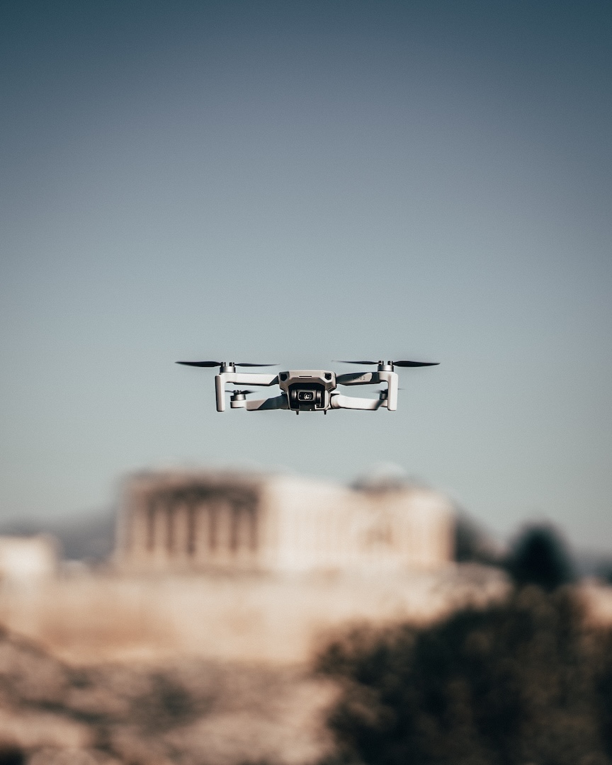 Closeup of a drone on a blurred Athens background